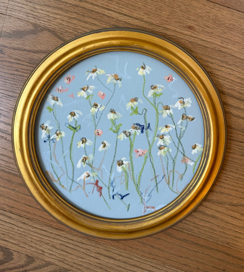 Encore framed round original artwork on wood floor