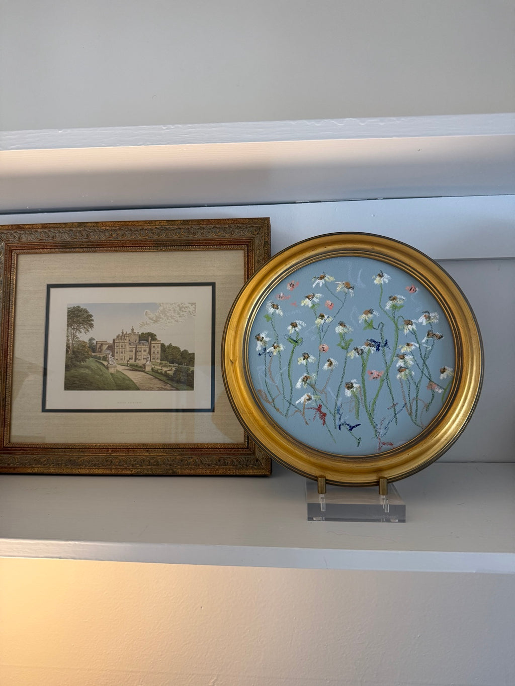 Encore framed round original artwork styled on a shelf